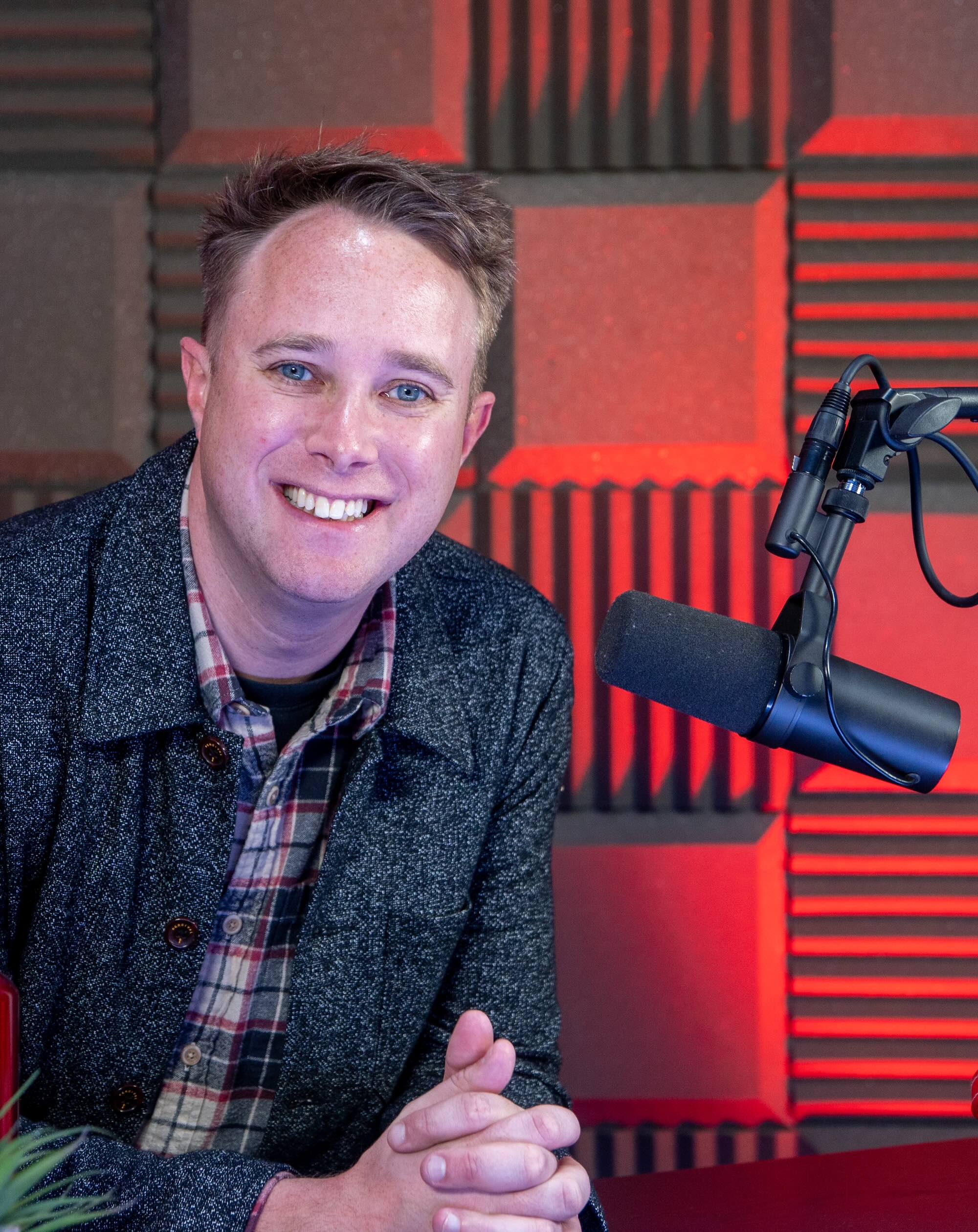 James Mulvany in recording studio with equipment.